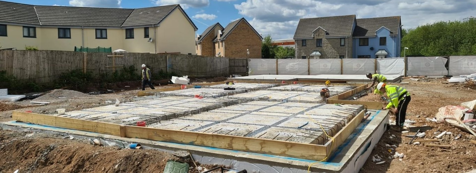 A concrete slab being prepared on a housing site